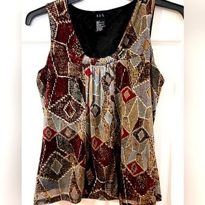 R.Q.T. Small polyester ladies top. Very complimentary on. Fall colors